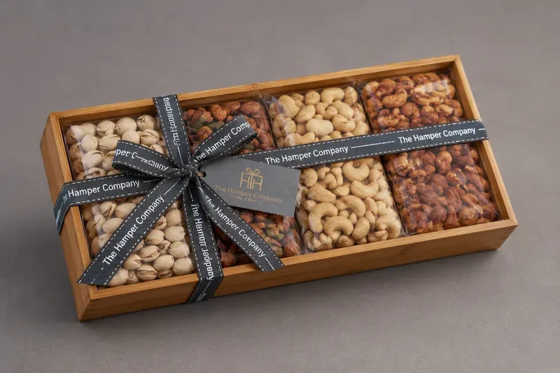 Dry Fruits Gift Hamper — Wooden Platter Box Top view of handcrafted wooden dry fruits platter showing premium nut assortment with decorative arrangement