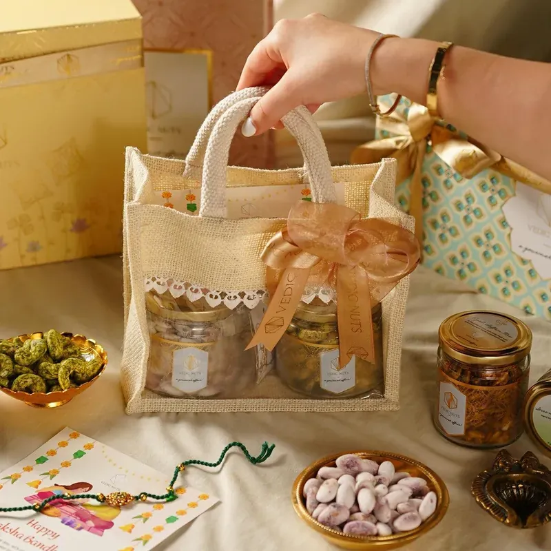 Rakhi Gift Hamper — Jute Potli with Dry Fruits Vedic Nuts jute potli Rakhi hamper with premium dry fruits and traditional Rakhi thread — festive gift India