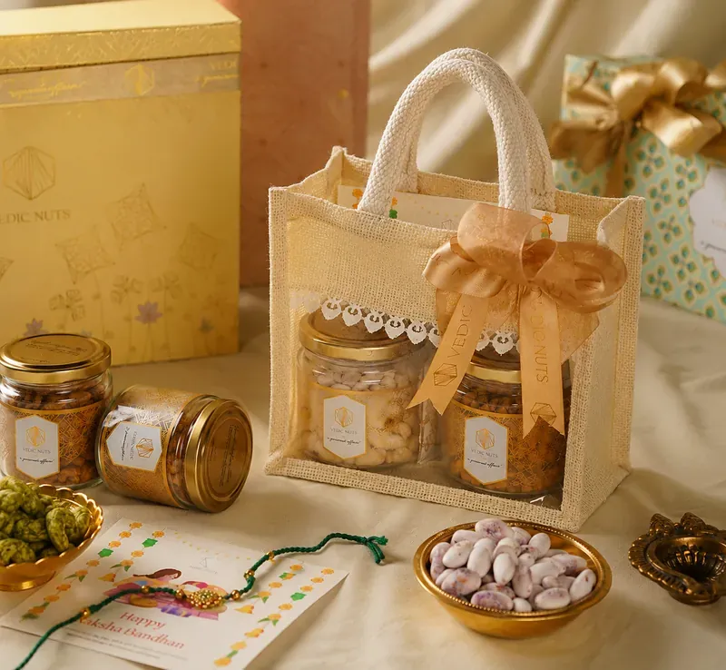 Rakhi Gift Hamper — Jute Potli with Dry Fruits Inside view of Vedic Nuts Rakhi hamper showing handwoven jute potli bags with assorted dry fruits