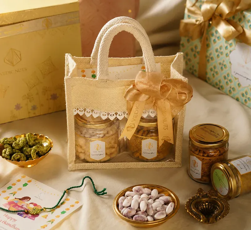 Rakhi Gift Hamper — Jute Potli with Dry Fruits Close-up of Vedic Nuts jute potli Rakhi hamper contents including rakhi, roli chawal, and gourmet nuts