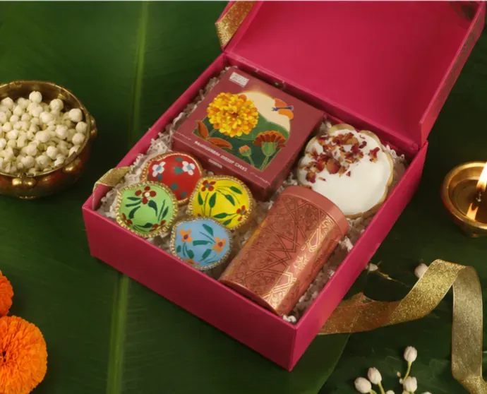 Diwali Festive Gift Box — Diya & Sweets Hamper Side view of Shubh Diwali fluorescent festive gift box with neon pink and gold premium packaging