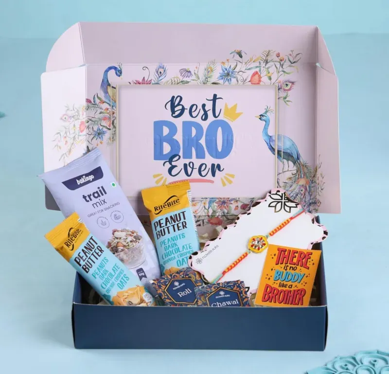Rakhi Gift Hamper for Brother — Snacks & Sweets Box Inside view of Best Bro Ever Rakhi gift hamper showing curated snacks and sweet treats arrangement