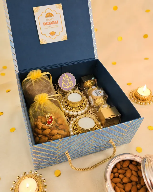 Diwali Gift Hamper — Dry Fruits & Kashmiri Kahwa Tea Close-up of luxury dry fruits and Kahwa tea gift box showing premium packaging and gold foil details